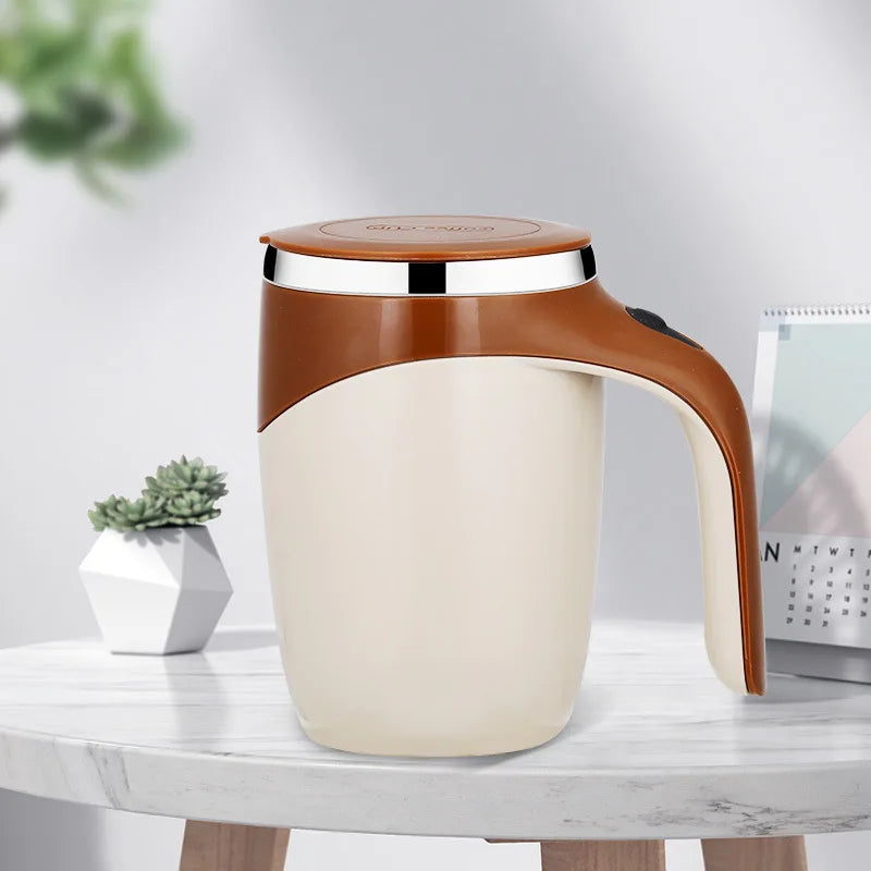 White mug with brown handle and lid on a marble surface with a plant and magazine in the background