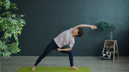 Woman practicing yoga in a room