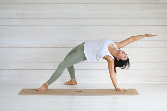 Woman in yoga pose on mat
