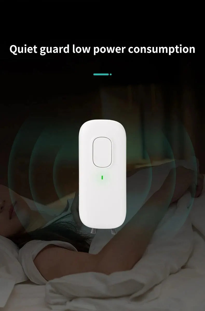 White electronic device with green indicator light on a dark background, labeled 'Quiet guard low power consumption'.